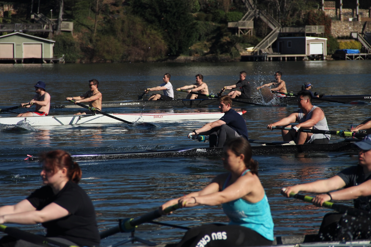 4 boats racing with eachother in practice in Lake Lure, North Carolina.